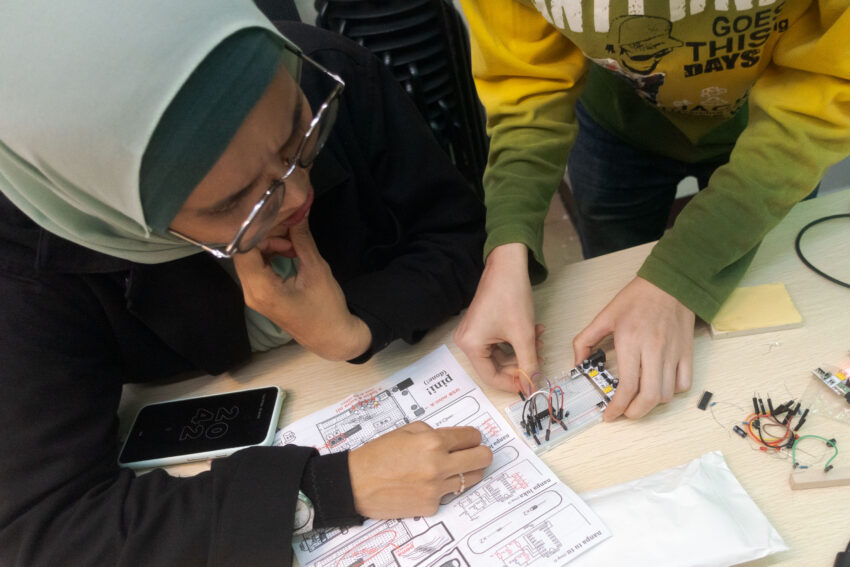 Photo of workshop about building a counting device on a breadboard